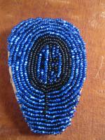 a second beaded necklace featuring petroglyth.